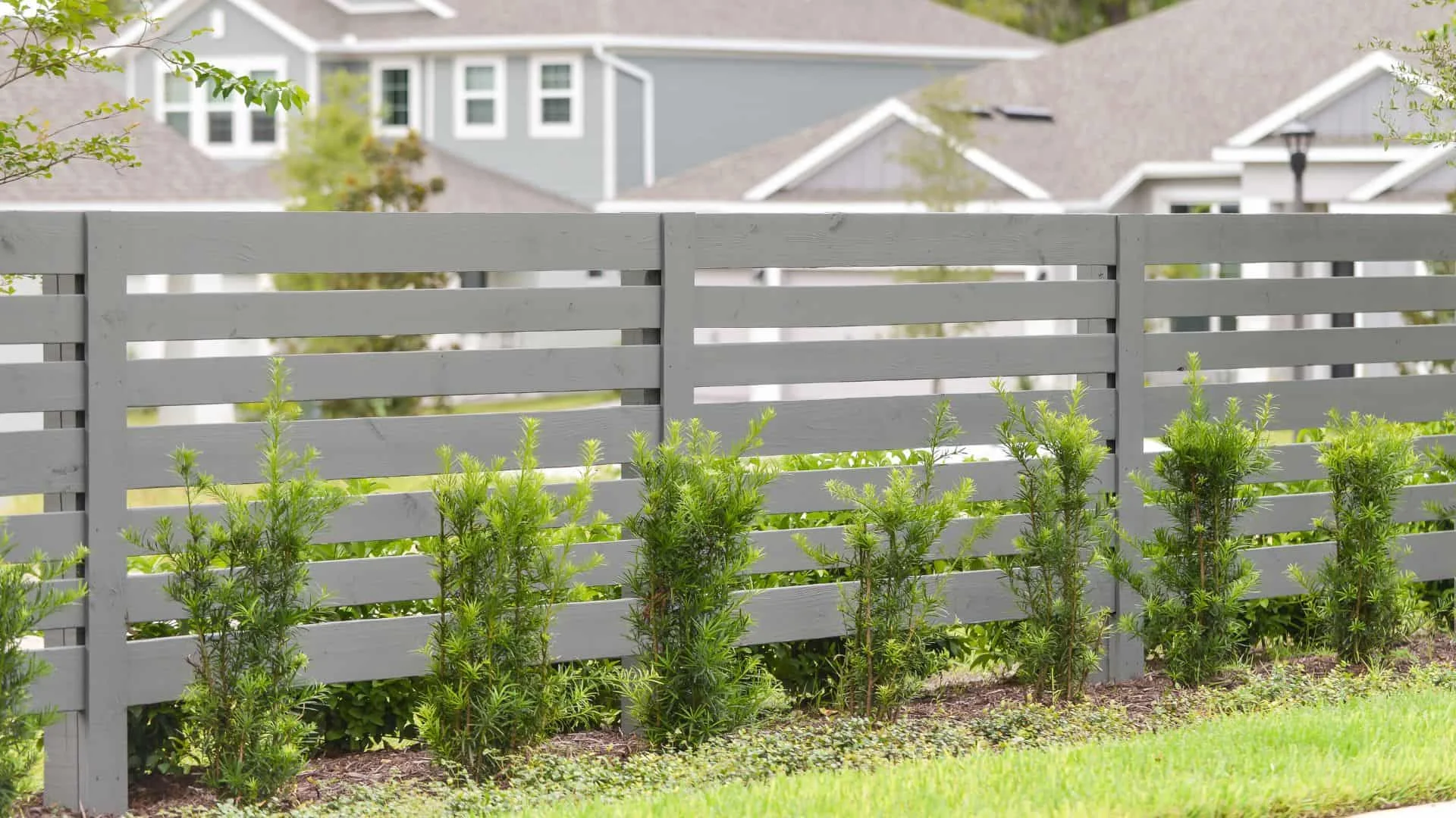 How to Love Your Gray Wood Fence Instead of Fighting It